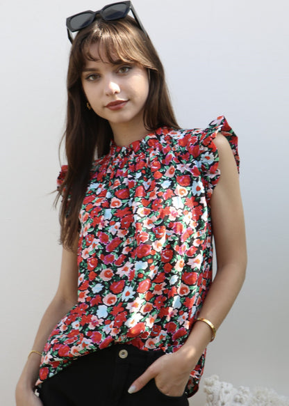 Blusa con detalle de volante y estampado floral