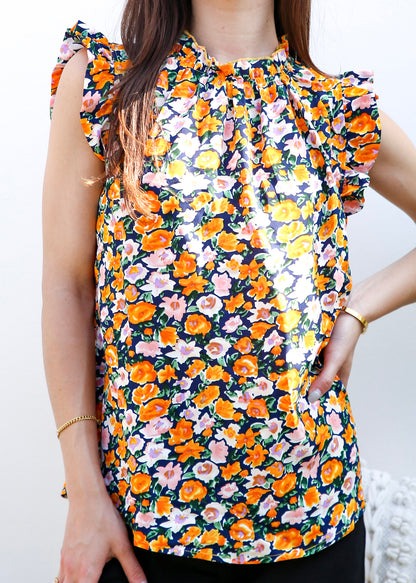 Blusa con detalle de volante y estampado floral