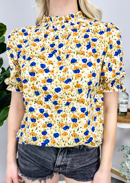 Blusa vintage de cuello alto con flores