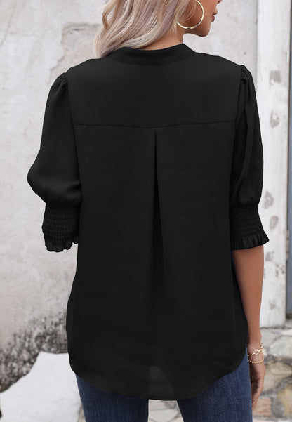 Blusa con mangas abullonadas y pliegues en la espalda