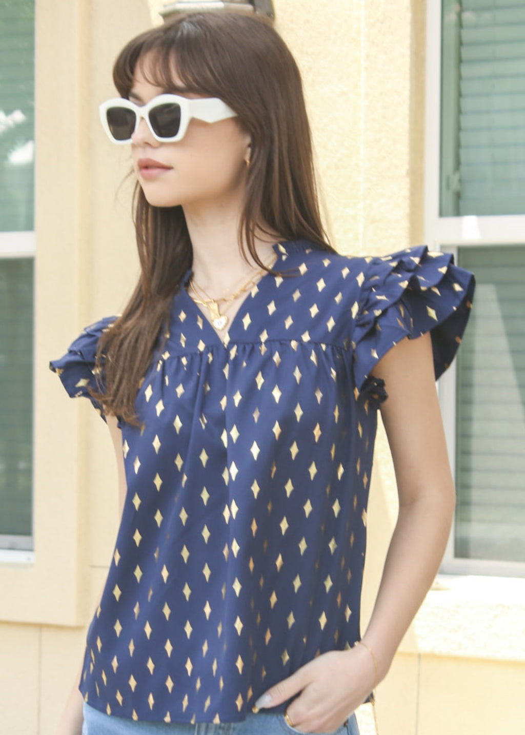 Blusa con mangas con volantes y estampado brillante