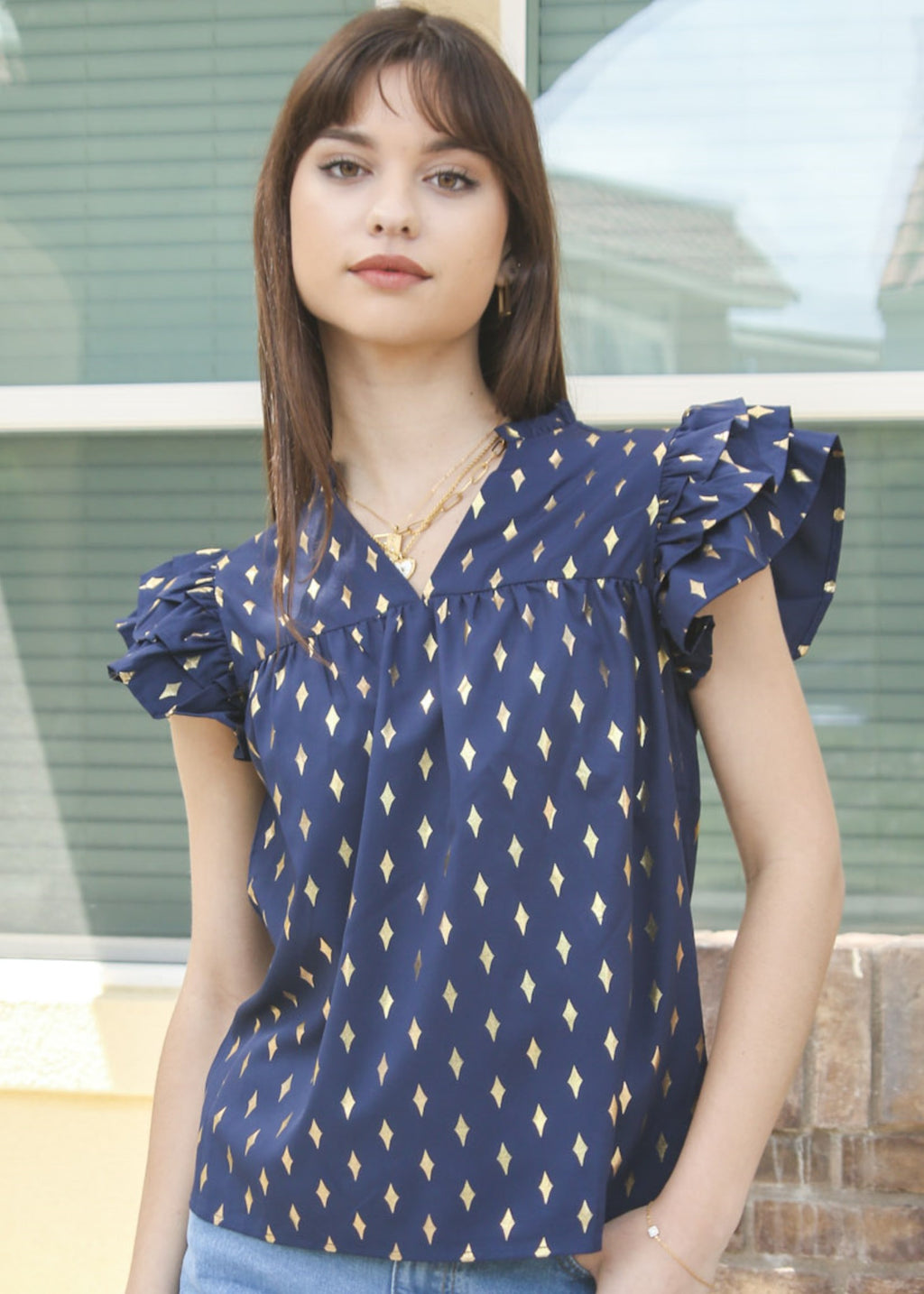 Blusa con mangas con volantes y estampado brillante