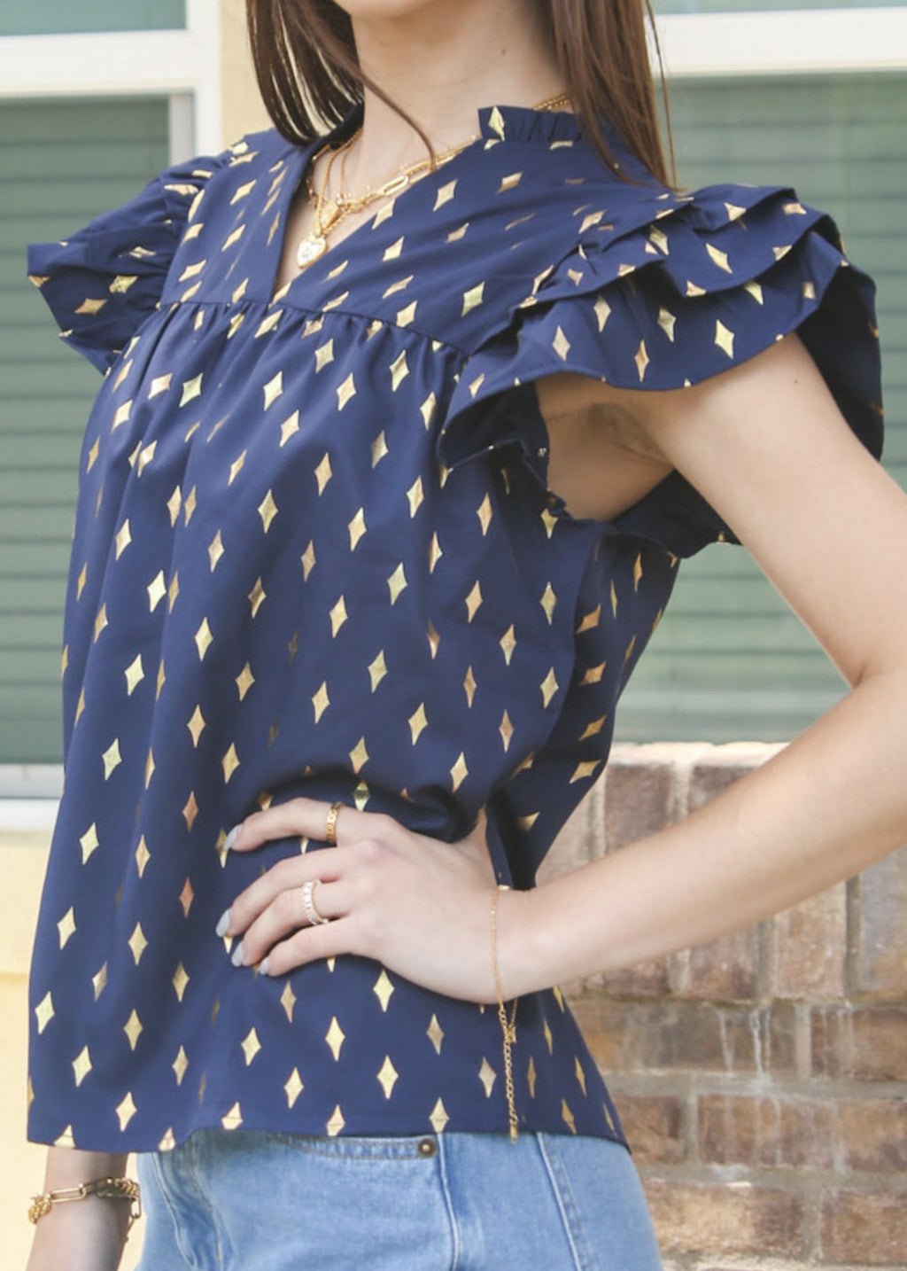 Blusa con mangas con volantes y estampado brillante