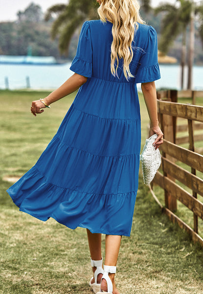 Vestido midi con capas y lazo en el cuello con borlas