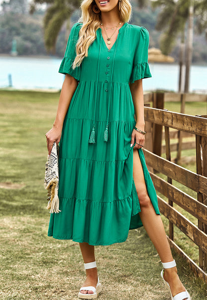 Vestido midi con capas y lazo en el cuello con borlas