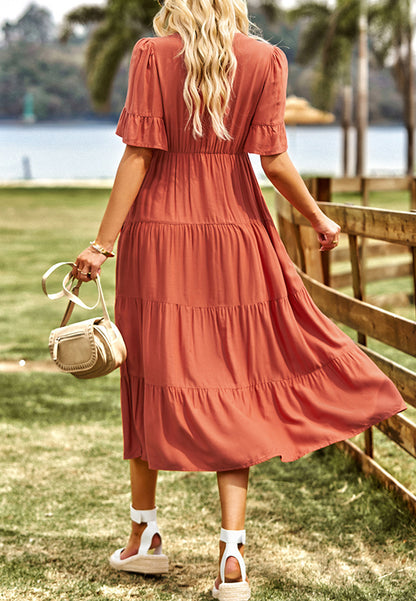 Vestido midi con capas y lazo en el cuello con borlas