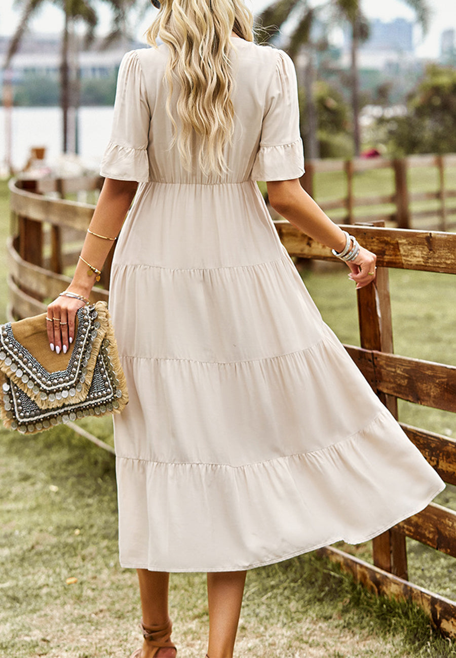 Vestido midi con capas y lazo en el cuello con borlas