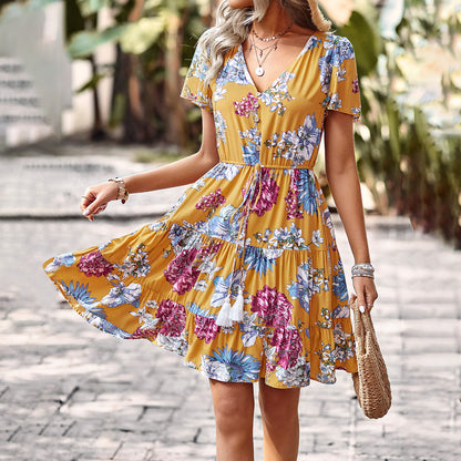 Vestido floral con lazo en la cintura y borlas