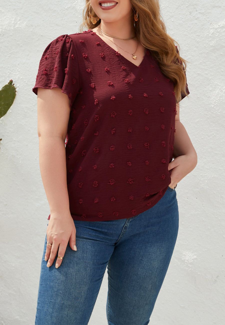 Blusa de lunares suizos con cuello en V y talla grande