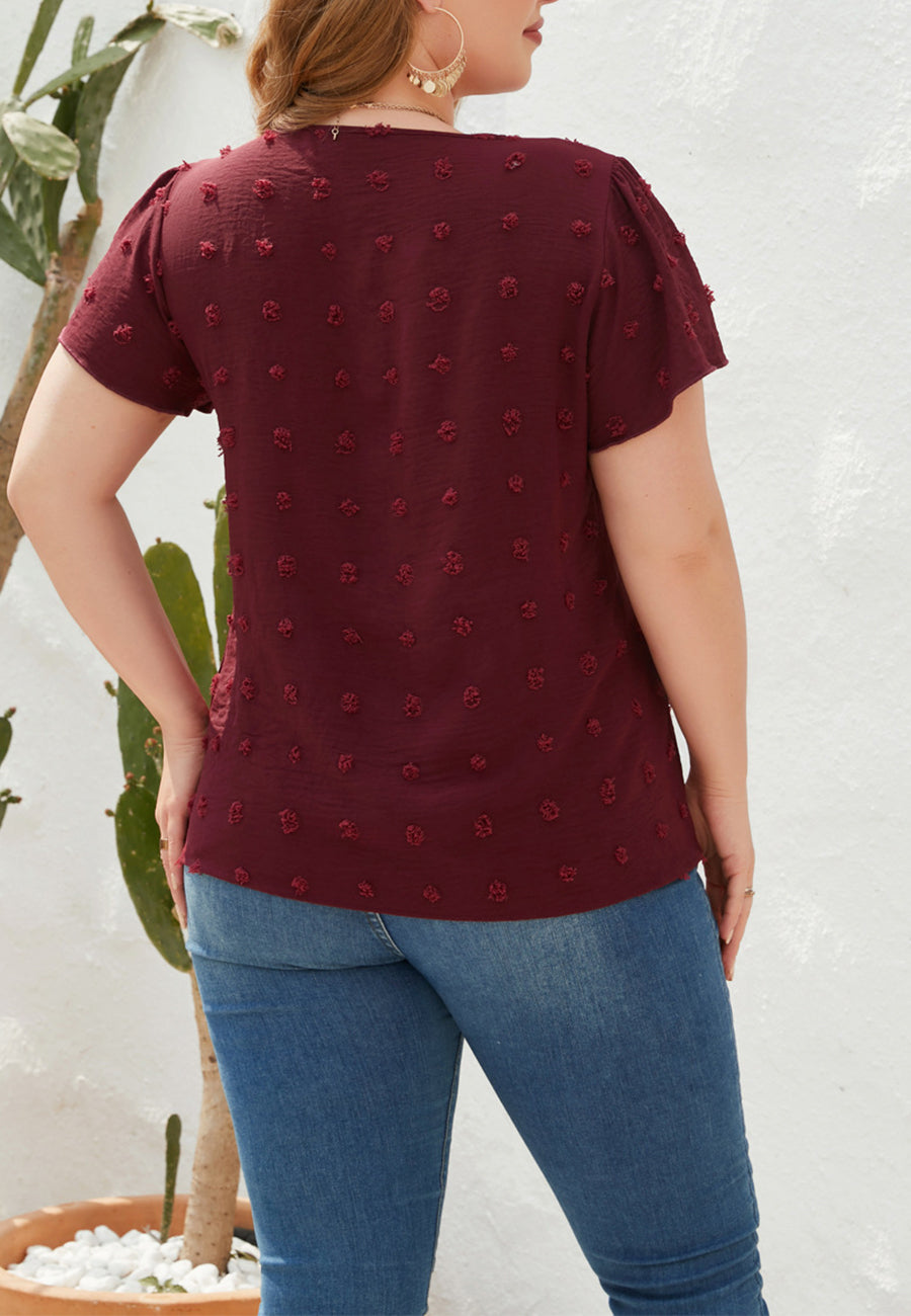 Blusa de lunares suizos con cuello en V y talla grande