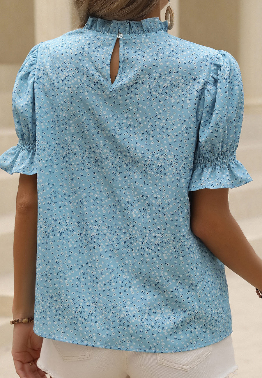 Blusa con escote con volantes y abertura en la espalda