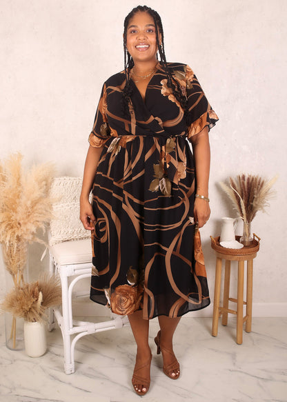 Vestido negro con estampado floral dorado en contraste y talla grande