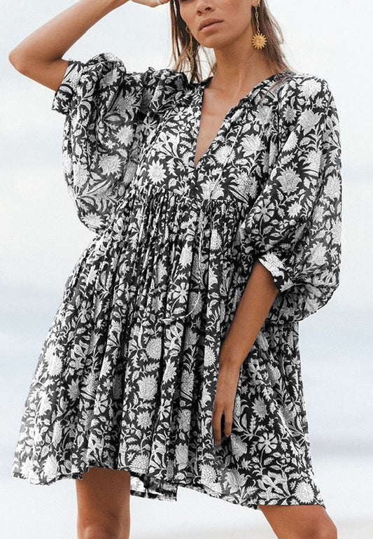 Vestido plisado con mangas dolman y estampado floral