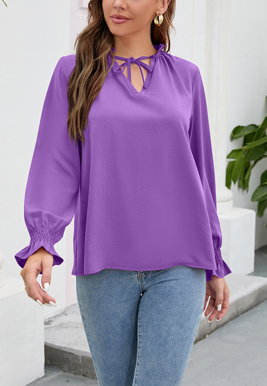 Blusa lisa con cuello anudado y volantes