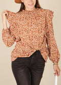Blusa con estampado floral y detalle de volantes por todas partes