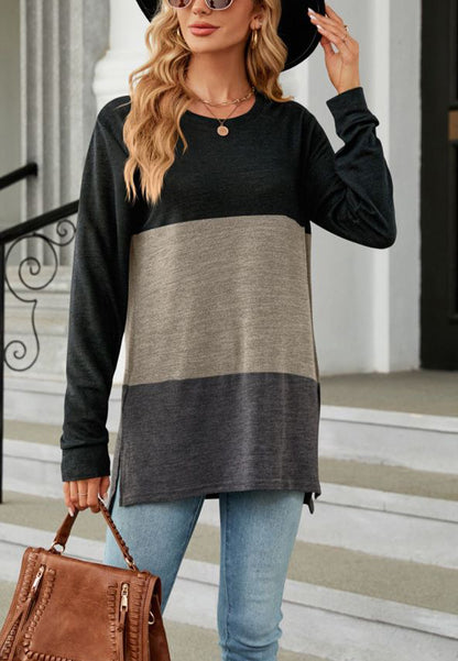 Suéter largo con aberturas laterales y diseño de bloques de color