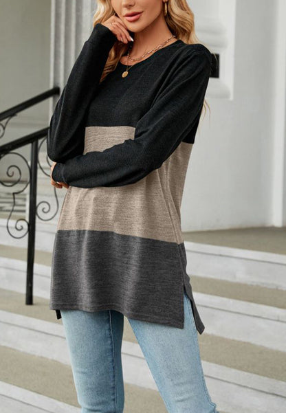 Suéter largo con aberturas laterales y diseño de bloques de color