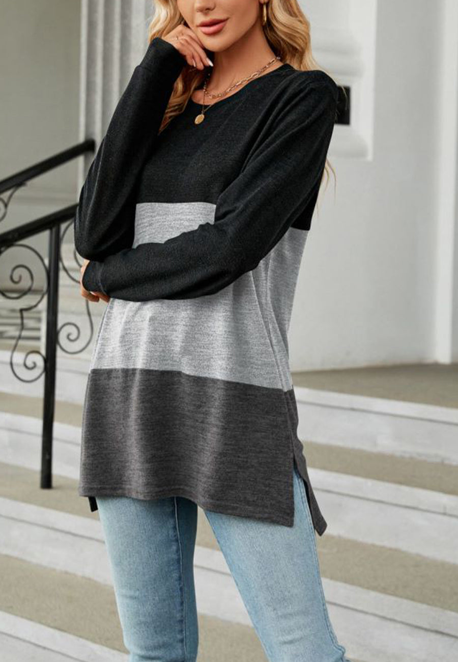 Suéter largo con aberturas laterales y diseño de bloques de color