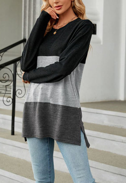 Suéter largo con aberturas laterales y diseño de bloques de color