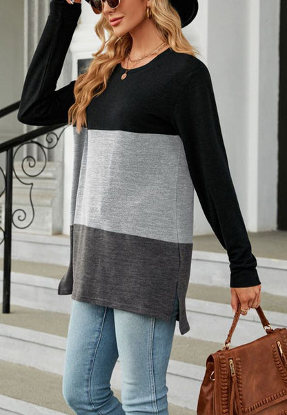 Suéter largo con aberturas laterales y diseño de bloques de color