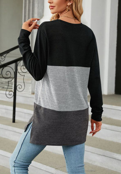 Suéter largo con aberturas laterales y diseño de bloques de color