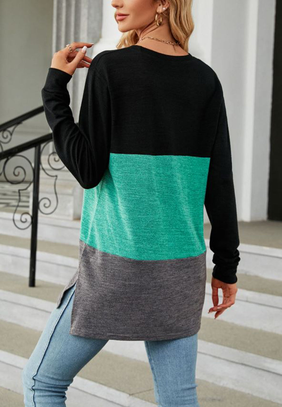 Suéter largo con aberturas laterales y diseño de bloques de color