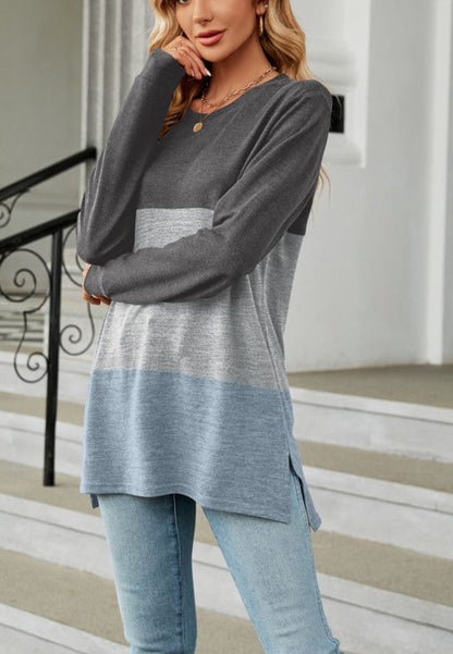 Suéter largo con aberturas laterales y diseño de bloques de color