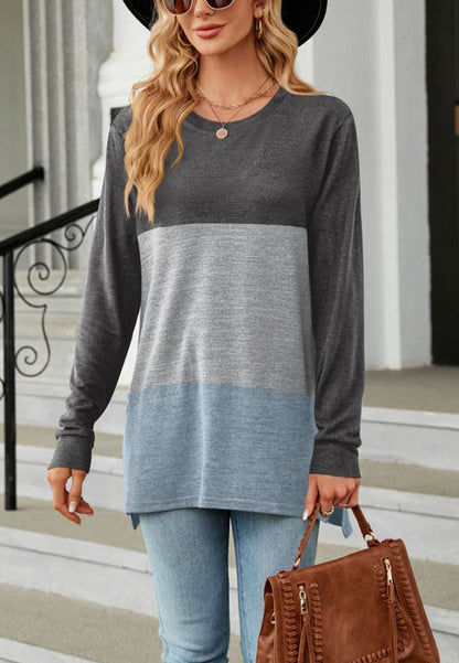 Suéter largo con aberturas laterales y diseño de bloques de color