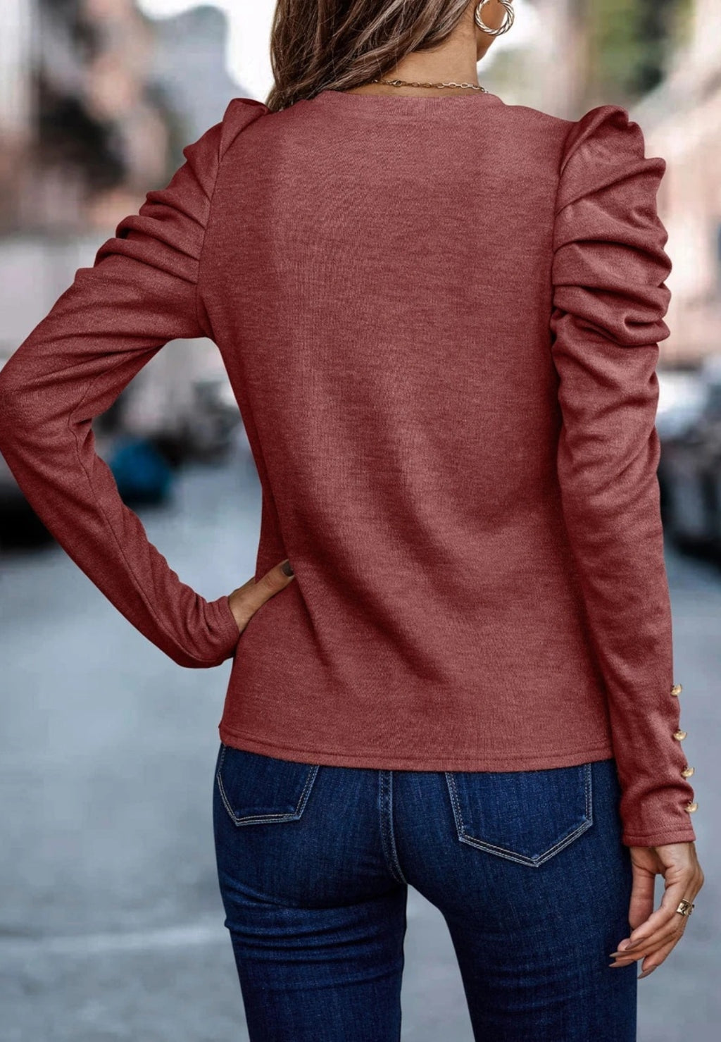Blusa plisada con mangas gigot