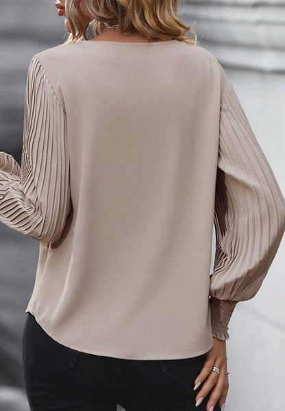 Blusa Bishop plisada de manga larga y escote en V