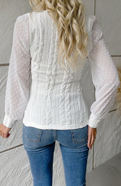 Blusa texturizada de manga larga con lunares transparentes
