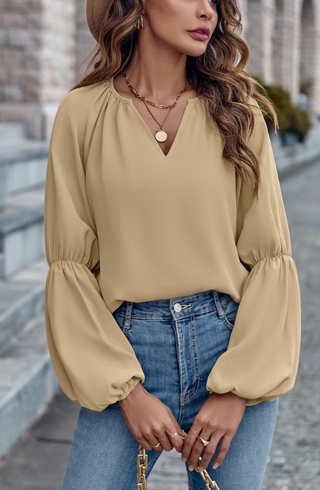 Blusa lisa con mangas abullonadas dobles