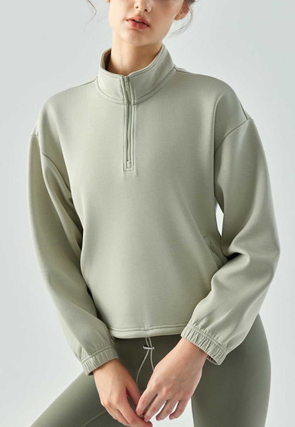 Suéter de cuello alto con dobladillo con cordón ajustable