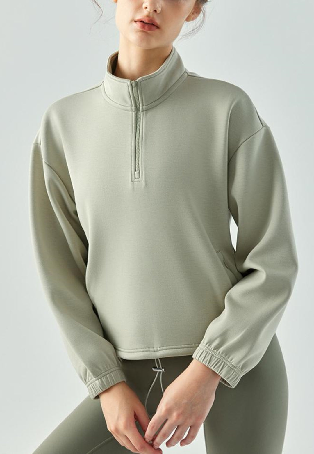 Suéter de cuello alto con dobladillo con cordón ajustable