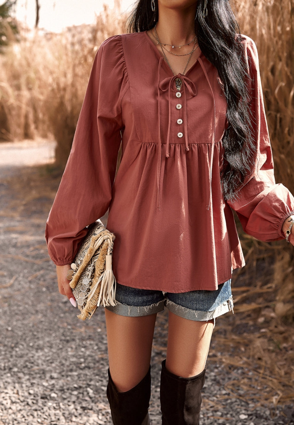 Blusa con botones y cuello con lazo doble
