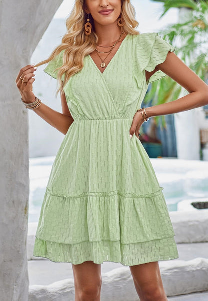 Vestido con detalle de ojales y mangas con volantes