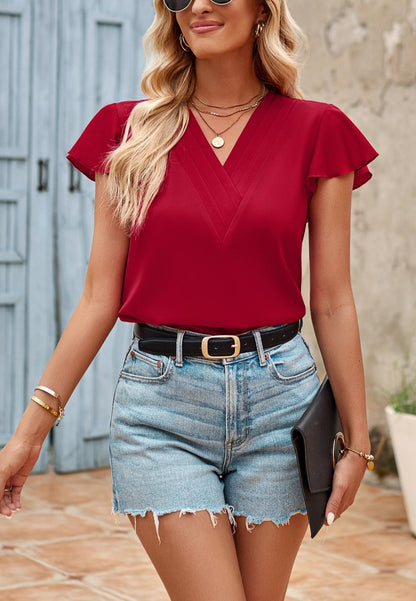 Blusa plisada con escote en V y mangas onduladas