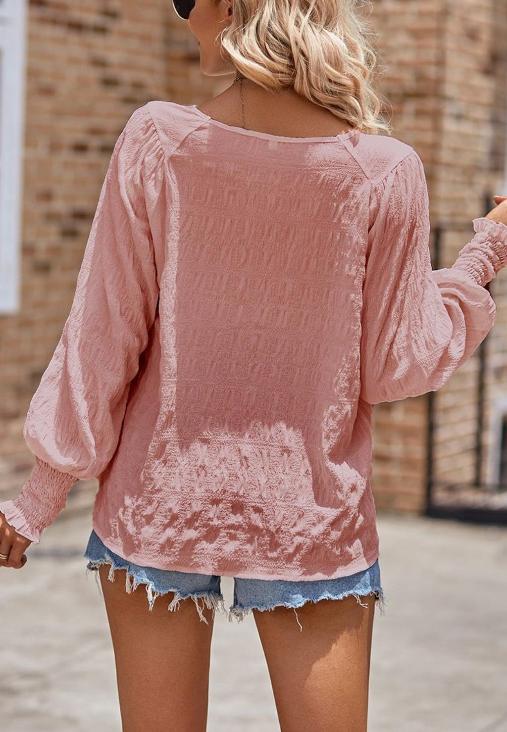 Blusa texturizada con puños fruncidos