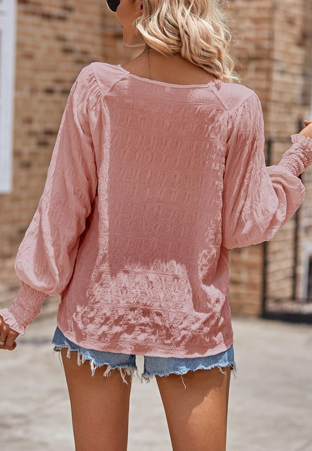 Blusa texturizada con puños fruncidos