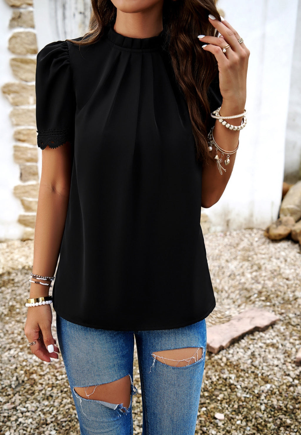 Blusa con mangas abullonadas y detalle plisado
