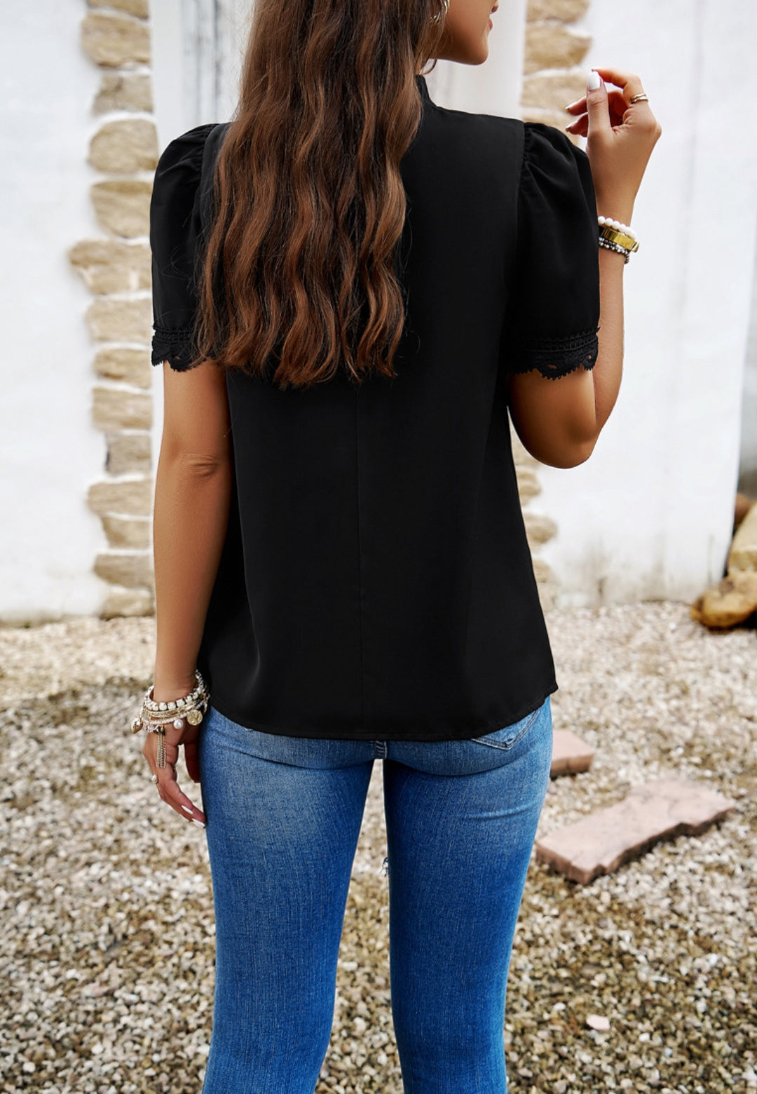 Blusa con mangas abullonadas y detalle plisado