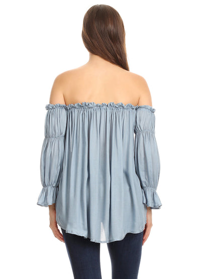 Blusa estilo bohemio semitransparente con hombros descubiertos