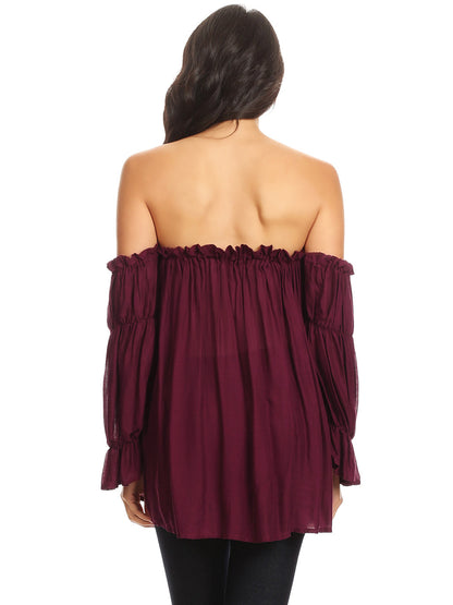 Blusa estilo bohemio semitransparente con hombros descubiertos