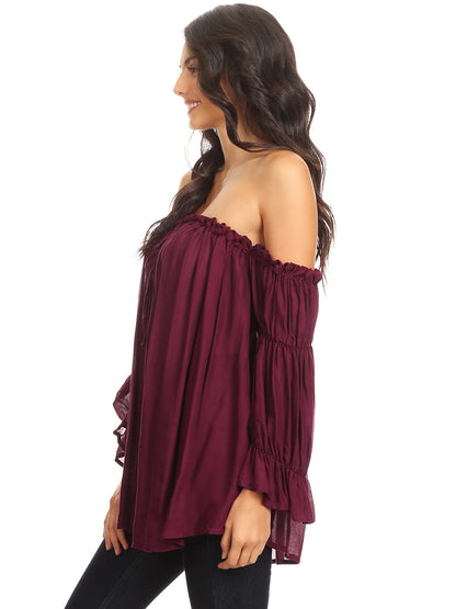 Blusa estilo bohemio semitransparente con hombros descubiertos