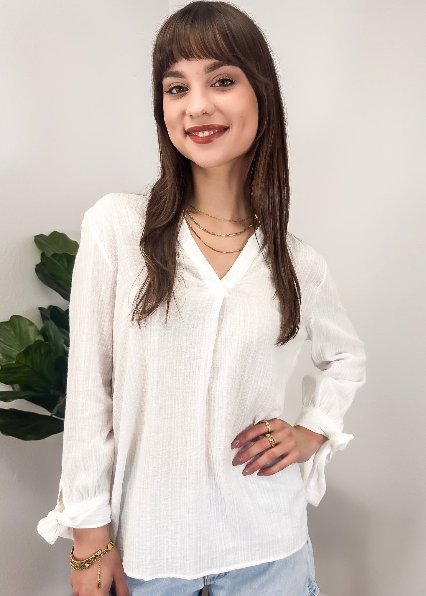 Blusa plisada con mangas abiertas