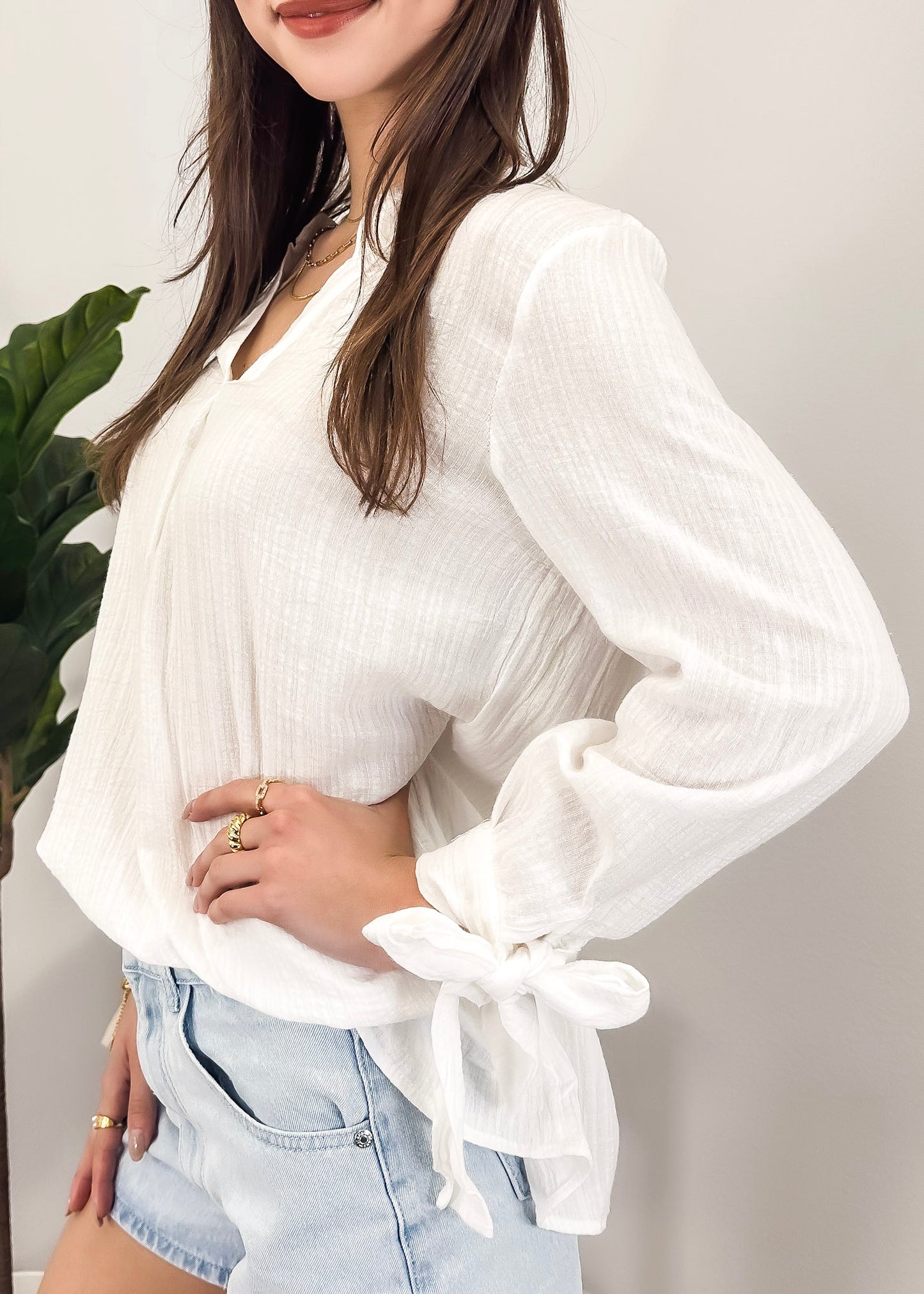 Blusa plisada con mangas abiertas