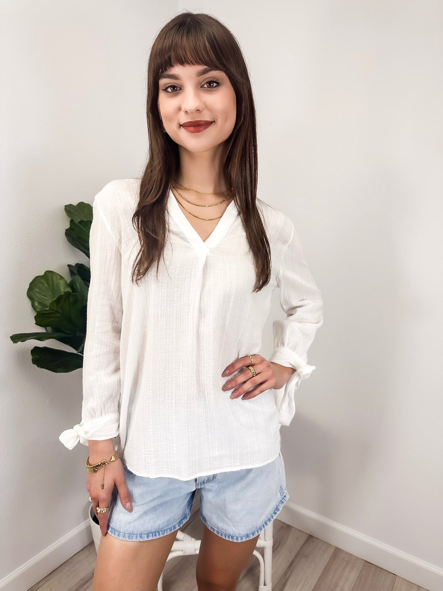 Blusa plisada con mangas abiertas