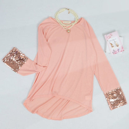 Blusa con mangas largas y puños con lentejuelas brillantes