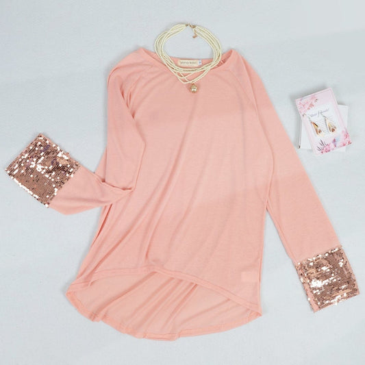 Blusa con mangas largas y puños con lentejuelas brillantes
