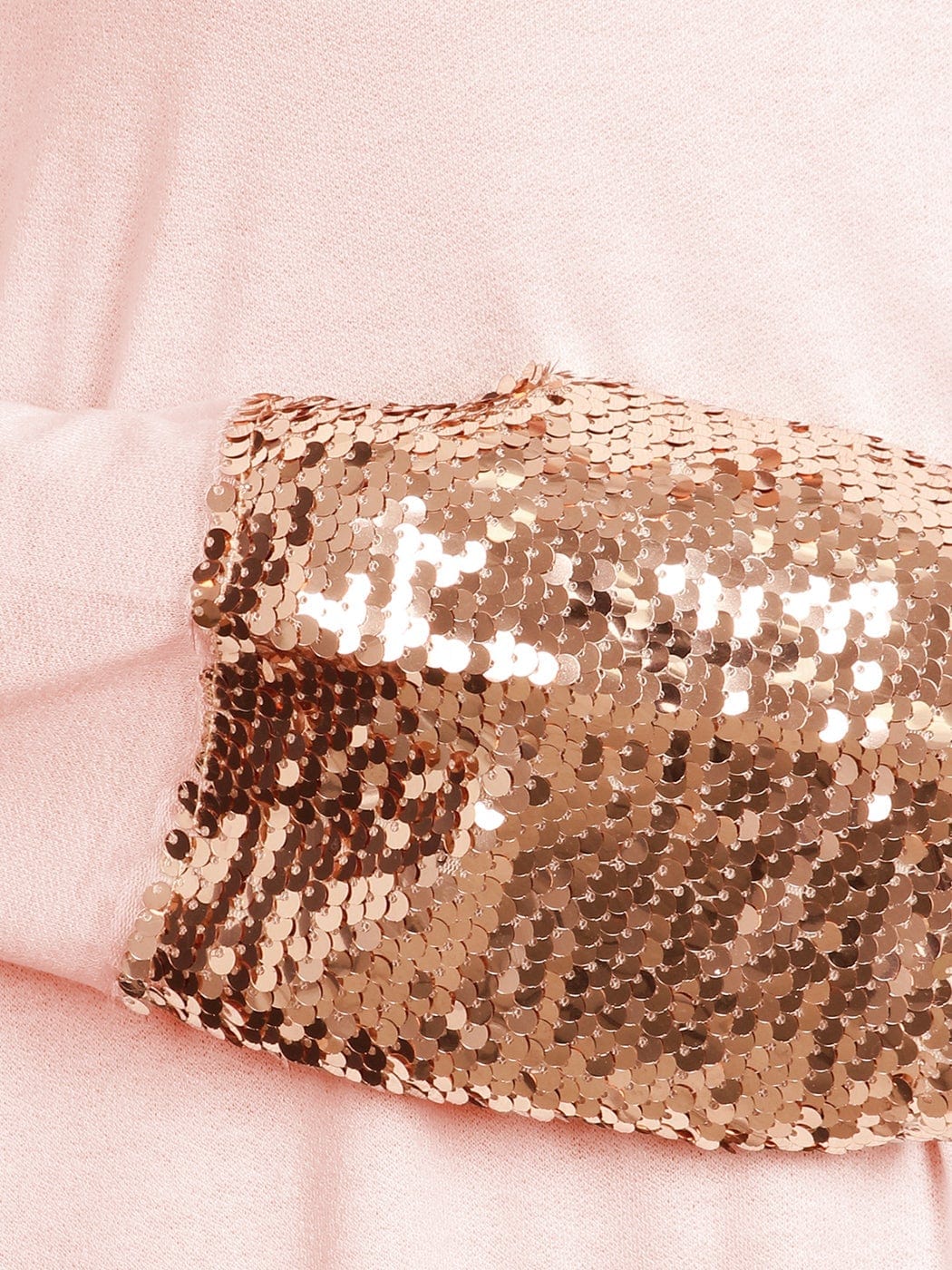Blusa con mangas largas y puños con lentejuelas brillantes